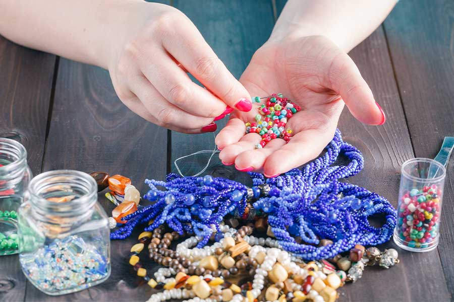 Beading needle in hand