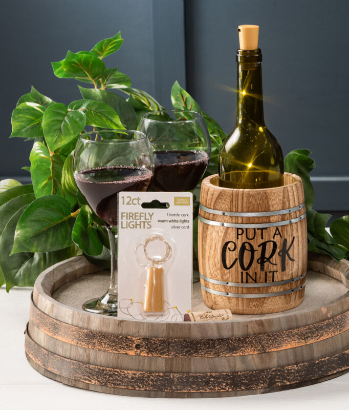 cork with lights and wine barrel decor